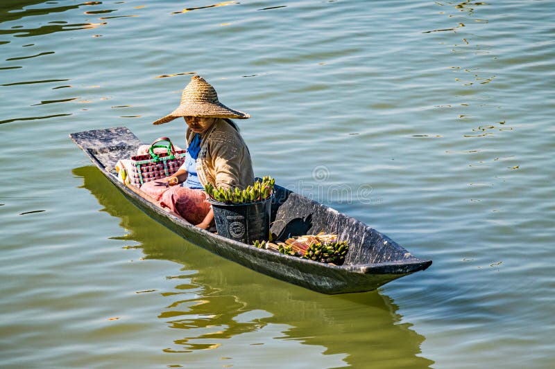 Local flower trader on a small boat on Inle Lake. stock photography Local flower trader on a small boat on Inle Lake. stock photography