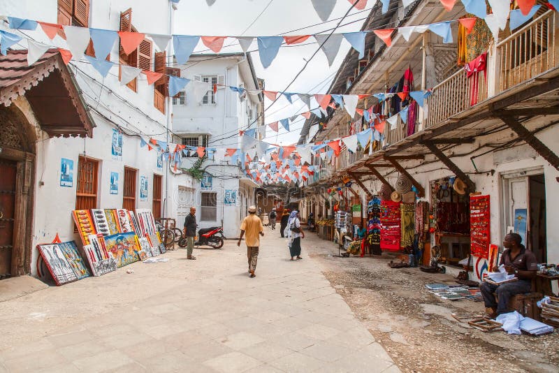 Local people on a square in Stone Town. Stone Town is the old part of Zanzibar City, the capital of Zanzibar, Tanzania stock images Local people on a square in Stone Town. Stone Town is the old part of Zanzibar City, the capital of Zanzibar, Tanzania stock images