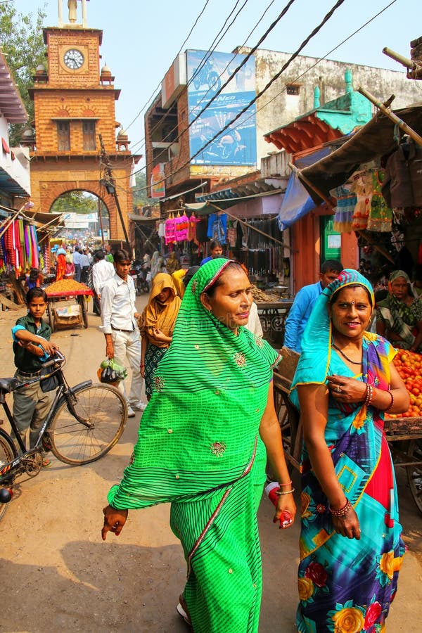 Local people walking through street market in Fatehpur Sikri, Uttar Pradesh, India. The city was founded in 1569 by the Mughal Emperor Akbar, and served as the capital of the Mughal Empire from 1571 to 1585