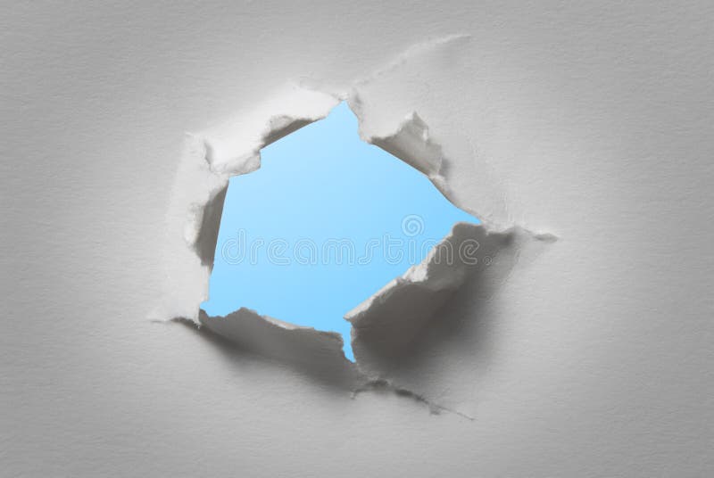 Hole in white paper with light blue background. Hole in white paper with light blue background