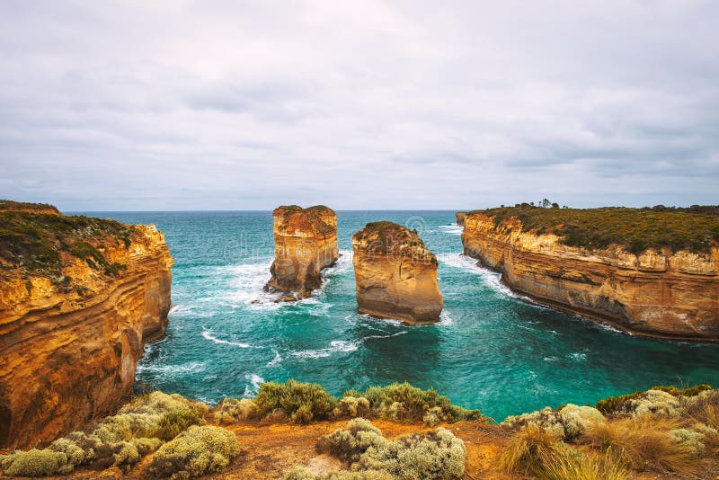 Loch Ard Gorge along the famous Great Ocean Road in Victoria, Australia, near Port Campbell and The Twelve Apostles. Artistic vintage style processing. Loch Ard Gorge along the famous Great Ocean Road in Victoria, Australia, near Port Campbell and The Twelve Apostles. Artistic vintage style processing.