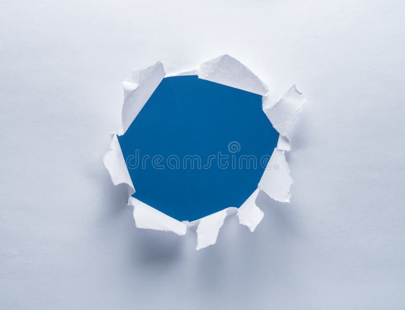 Loch auf einem Papier stockbild Loch auf einem Papier stockbild