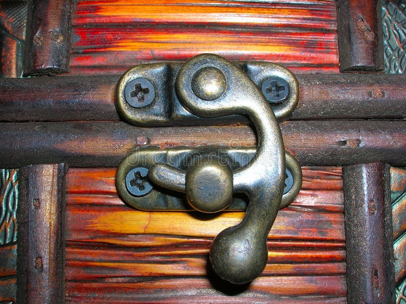 Locked lock of wooden box. Button clasp stock images, royalty-free photos and pictures