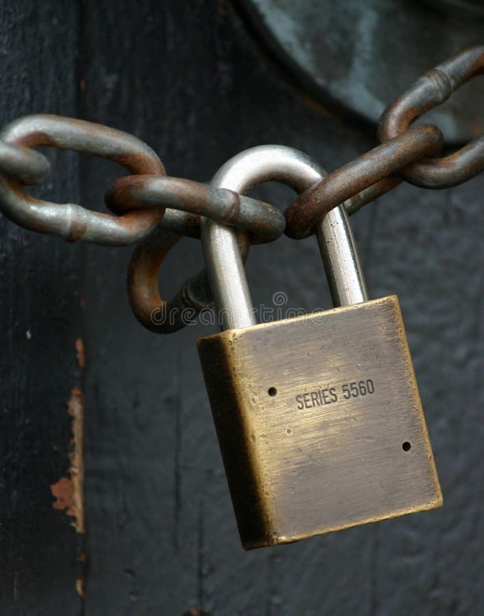 A Chain And Lock On A Black Surface Stock Photo, Picture and Royalty Free  Image. Image 206610255.