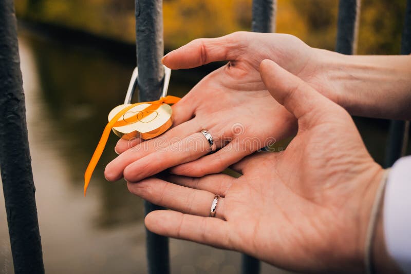 The Lock in Hands of the Newlymarried Couple Stock Photo Image of