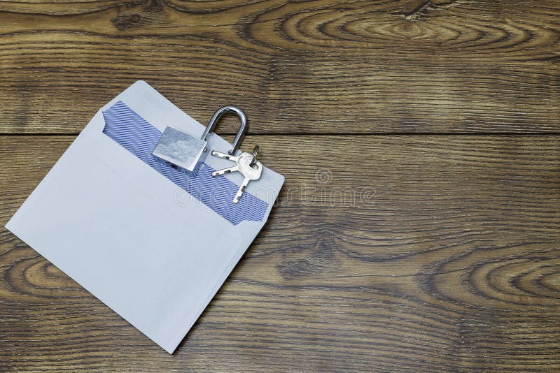 Keys, Pen and Envelope on the Wooden Table. Selling or Rental of Flat