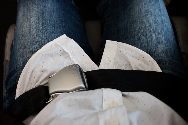 Locked Airplane Seat Belt Over Passenger Lap Stock Image Image of