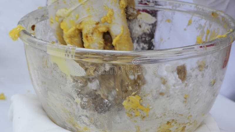 Locked-on shot of chef mixing dough in bowl for cookies in Hotel Amar Villas, Agra, Uttar Pradesh, India