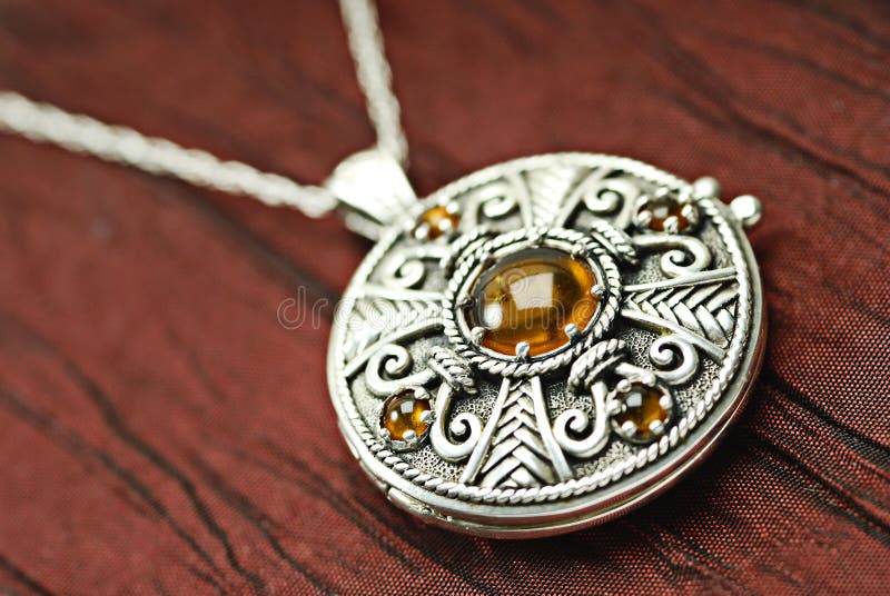 Celtic silver locket with amber. Celtic silver locket with amber