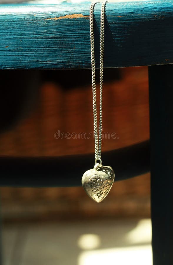 A vintage heart silver locket. A vintage heart silver locket