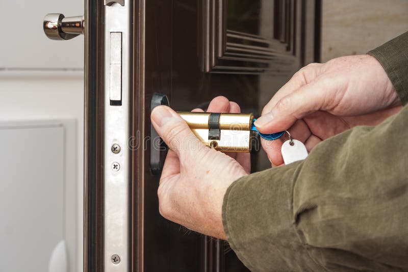 Locksmith replacing a cylinder lock