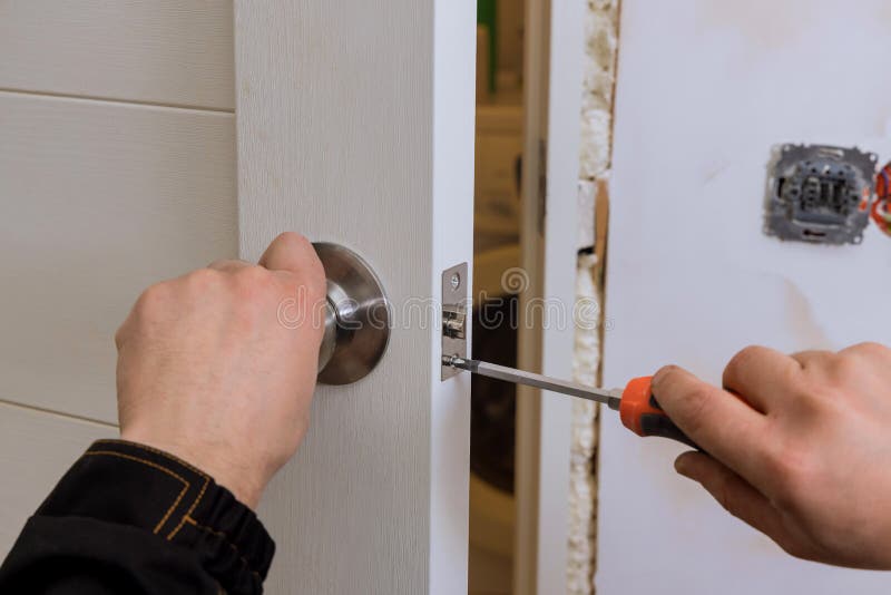 Locksmith Install the Door Lock in House. Stock Photo Image of