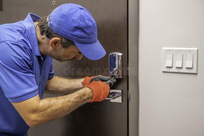 Locksmith Working on Deadbolt Lock Stock Image Image of labor, fixing