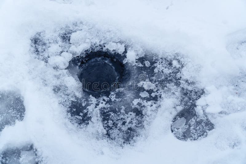 Ice hole in the ice for winter fishing. Ice hole in the ice for winter fishing