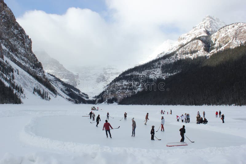 People play ice hockey on frozen Lake Louise in February. People play ice hockey on frozen Lake Louise in February