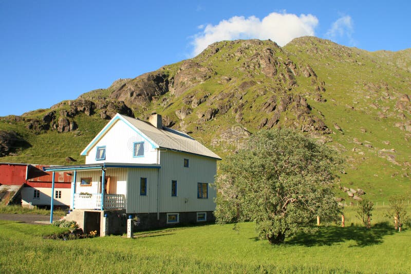 Lofoten s house under a cloudy hill