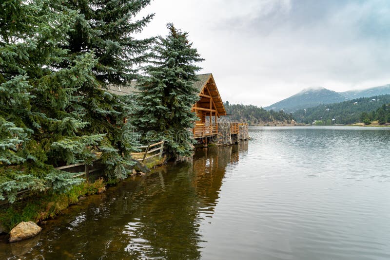 A log building and evergreen trees in Colorado