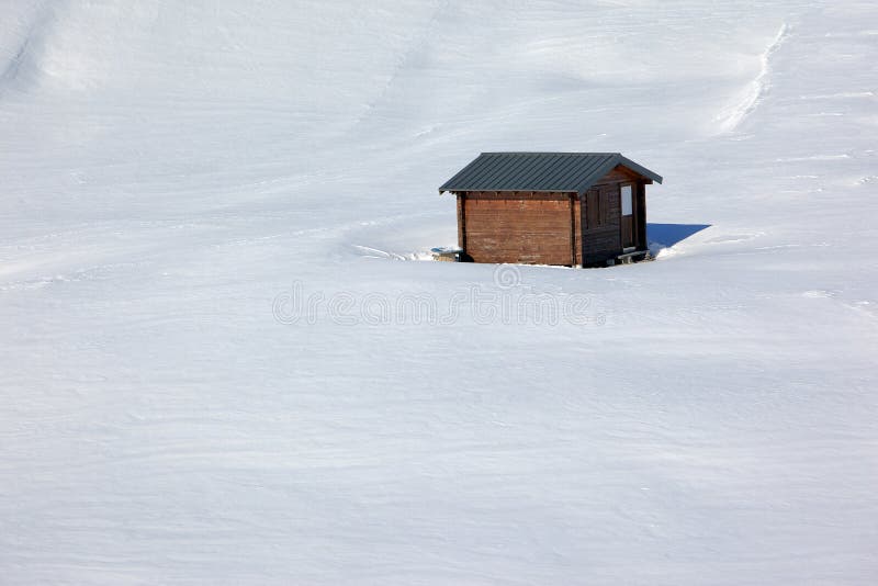 Log cabin isolated in virgin snow