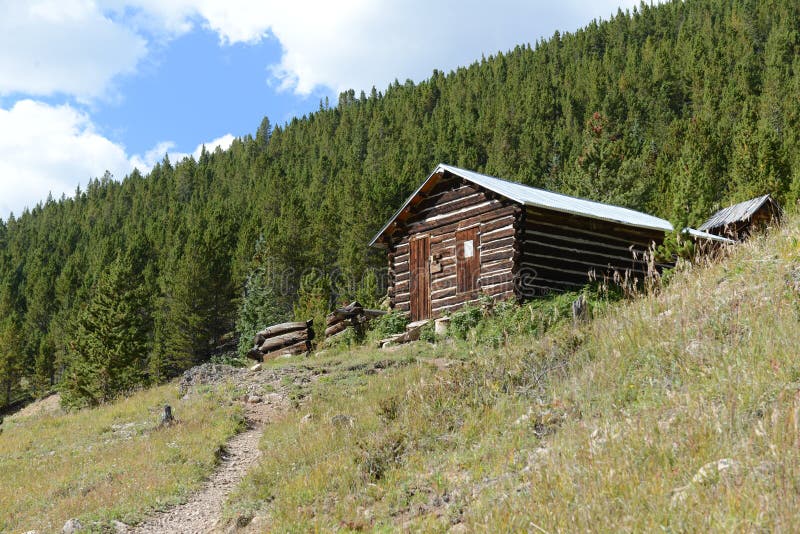 Log cabin in old mining town stock photography