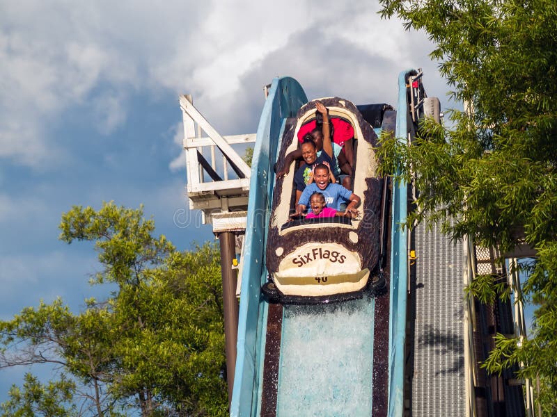 JACKSON, NEW JERSEY - JUNE 30: A Family enjoys a log flume ride at Six Flags Great Adventure on June 30 2007 in Jackson New Jersey. JACKSON, NEW JERSEY - JUNE 30: A Family enjoys a log flume ride at Six Flags Great Adventure on June 30 2007 in Jackson New Jersey