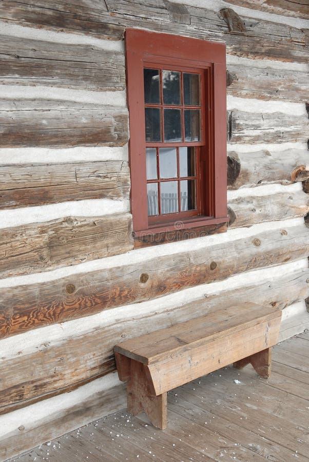 Log house window and bench