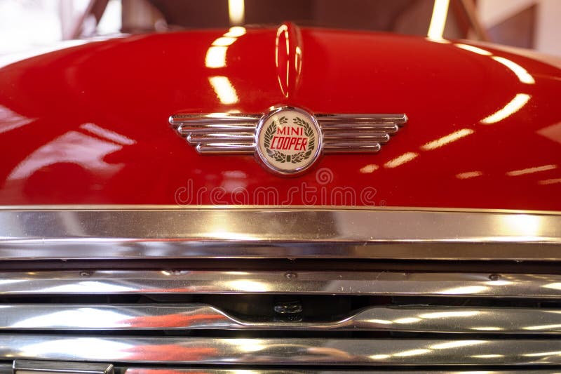 close-up logo vintage Red Classic Rover MINI Cooper 1.3 Oldtimer in showroom, iconic design technology, retro-style, Automotive Industry, Frankfurt, Germany - January 21, 2024. close-up logo vintage Red Classic Rover MINI Cooper 1.3 Oldtimer in showroom, iconic design technology, retro-style, Automotive Industry, Frankfurt, Germany - January 21, 2024