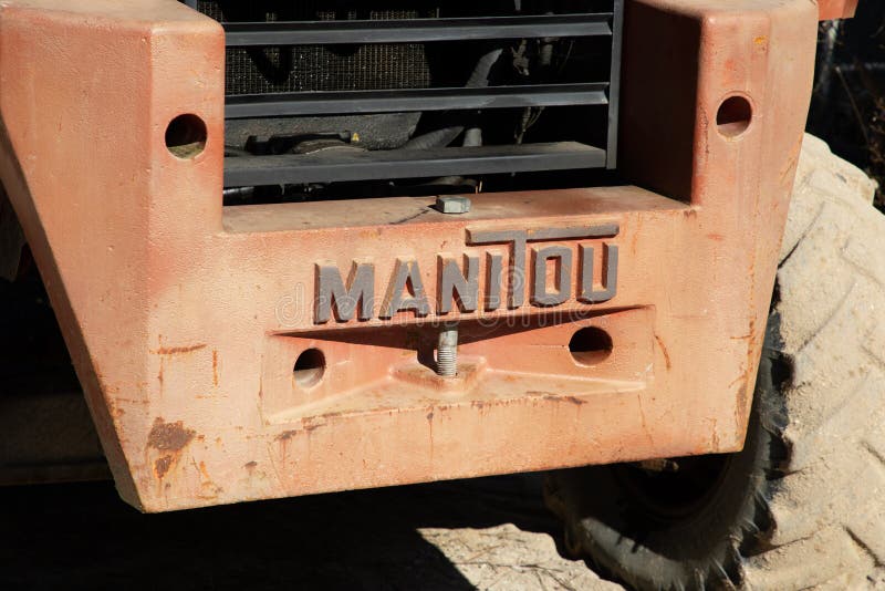 Bordeaux , Aquitaine France - 02 20 2023 : Manitou logo brand and text sign on old tractor rental forklift Handler industrial rent. Bordeaux , Aquitaine France - 02 20 2023 : Manitou logo brand and text sign on old tractor rental forklift Handler industrial rent