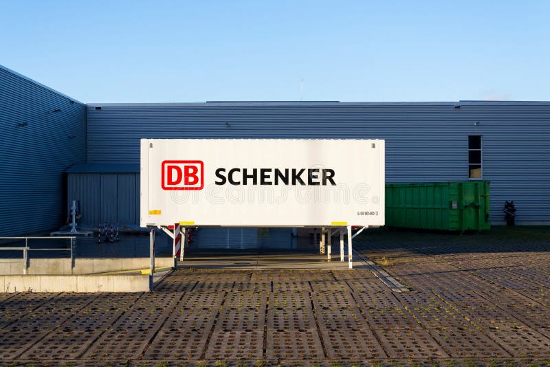Logotipo alemán de la compañía de la división de la logística Deutsche Bahn AG del operador del carril del DB Schenker en el cont fotografía de archivo