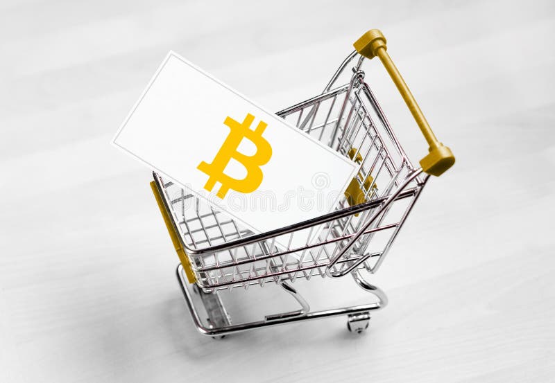 Logotipo de Bitcoin en una tarjeta de visita en carro de la compra fotografía de archivo Logotipo de Bitcoin en una tarjeta de visita en carro de la compra fotografía de archivo