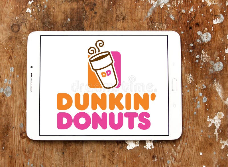 Logo of donut company and coffeehouse chain dunkin donuts on samsung tablet on wooden background. Logo of donut company and coffeehouse chain dunkin donuts on samsung tablet on wooden background