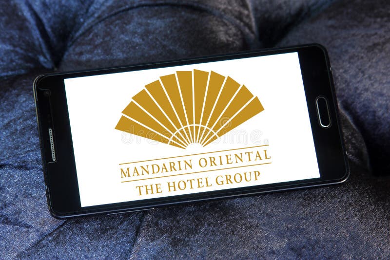 Logo of mandarin oriental hotels group on samsung mobile phone. Logo of mandarin oriental hotels group on samsung mobile phone