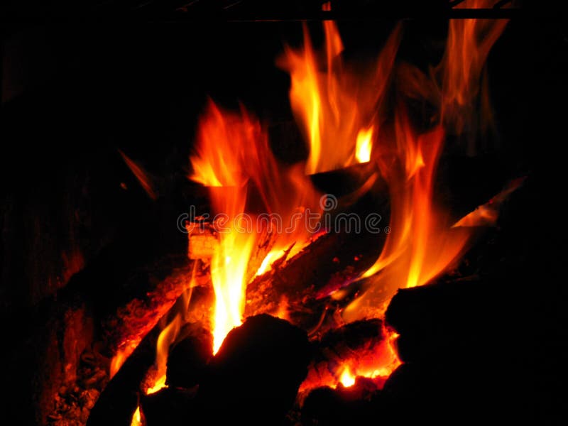 Logs Burning for Camp Fire stock images