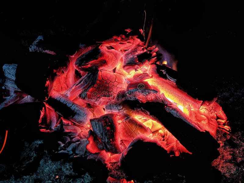 Hot coals, bonfire, logs burning stock image