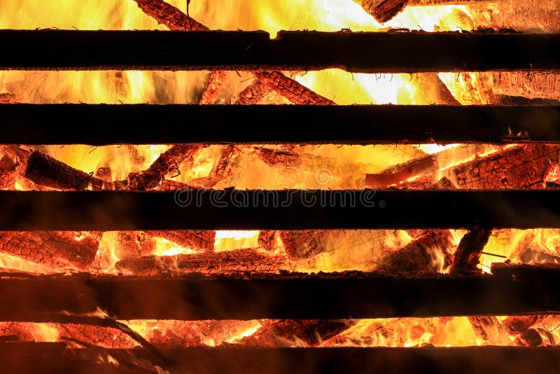 Logs in fire. Big huge traditional fire blaze glow. Background