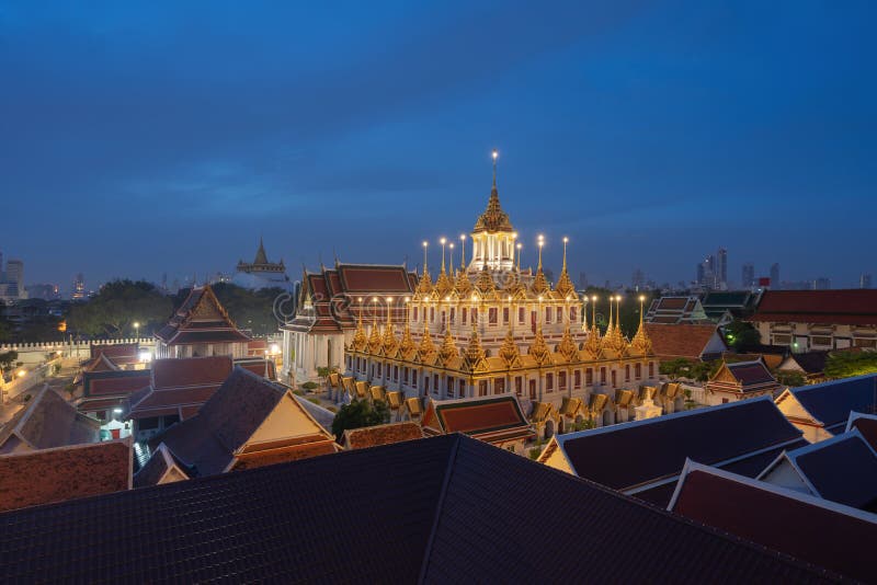 Loha Prasat Wat Ratchanatda and Golden Mountain pagoda, a buddhist temple or Wat Saket with skyscraper buildings in Bangkok