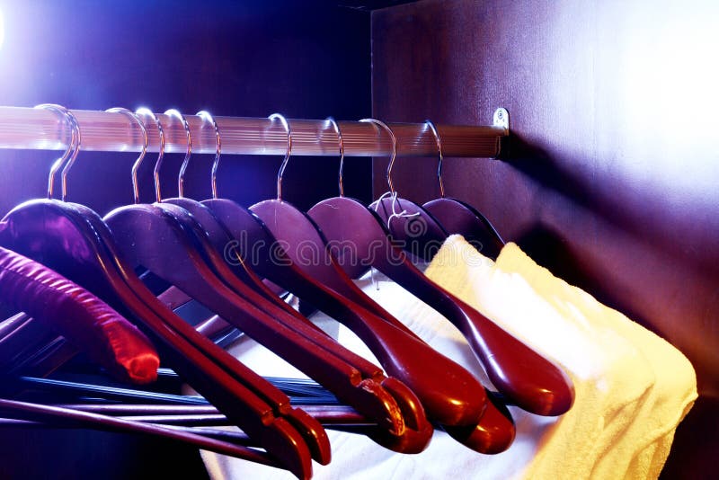 Clothes hangers in the fashion store. Clothes store concept. Clothes hangers in the fashion store. Clothes store concept