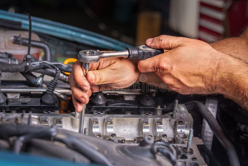 Men working in the auto repair shop. Men working in the auto repair shop