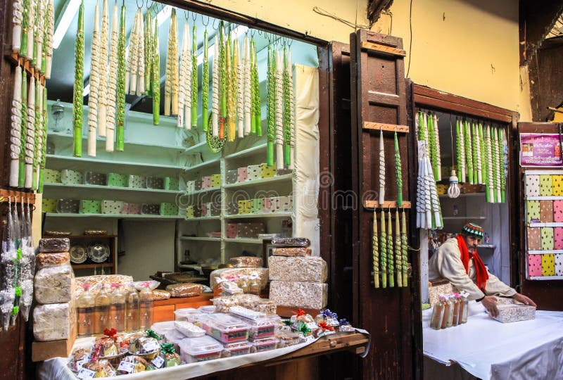 This is a Candy shop in Medina of Fez in Morocco. Founded in the 9th century and home to the oldest university in the world, Fez reached its height in the 13thâ€“14th centuries under the Marinids, when it replaced Marrakesh as the capital of the kingdom. The urban fabric and the principal monuments in the medina â€“ madrasas, fondouks, palaces, residences, mosques and fountains - date from this period. Although the political capital of Morocco was transferred to Rabat in 1912, Fez has retained its status as the country's cultural and spiritual centre. This is a Candy shop in Medina of Fez in Morocco. Founded in the 9th century and home to the oldest university in the world, Fez reached its height in the 13thâ€“14th centuries under the Marinids, when it replaced Marrakesh as the capital of the kingdom. The urban fabric and the principal monuments in the medina â€“ madrasas, fondouks, palaces, residences, mosques and fountains - date from this period. Although the political capital of Morocco was transferred to Rabat in 1912, Fez has retained its status as the country's cultural and spiritual centre.