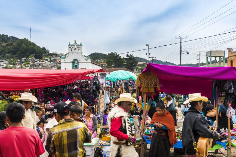 San Juan Chamula, Mexico - May 11, 2014: Local people in a street market in the town of San Juan Chamula, Chiapas, Mexico. San Juan Chamula, Mexico - May 11, 2014: Local people in a street market in the town of San Juan Chamula, Chiapas, Mexico