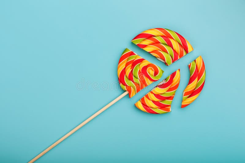 Lollipop Broken into Pieces on Blue Background, Top View with Copy ...