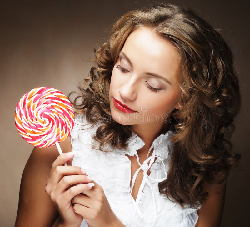 Lollipop in Hand. Beautiful Girl with Candy. Stock Photo - Image of ...