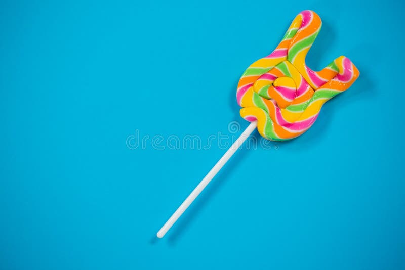 Lollypop on blue background royalty free stock images.