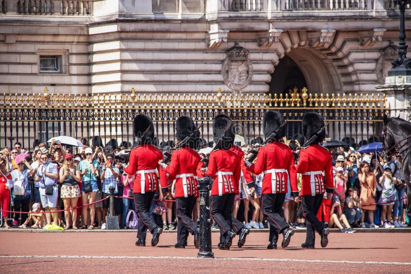 07-24 2019 London Changing of the Guard with bayonets marching through the the gates with crowd lined up to watch and take stock photography 07-24 2019 London Changing of the Guard with bayonets marching through the the gates with crowd lined up to watch and take stock photography