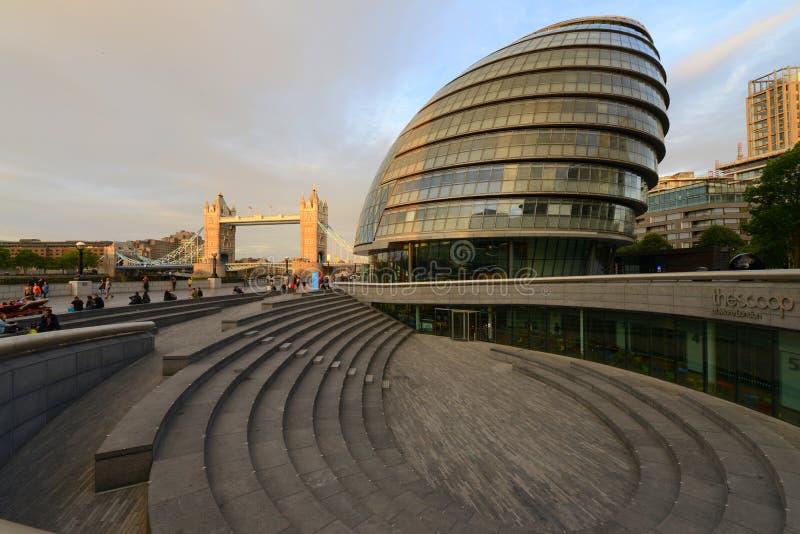 Modern curved lines of the city hall building in London on the Thames river banks. Modern curved lines of the city hall building in London on the Thames river banks