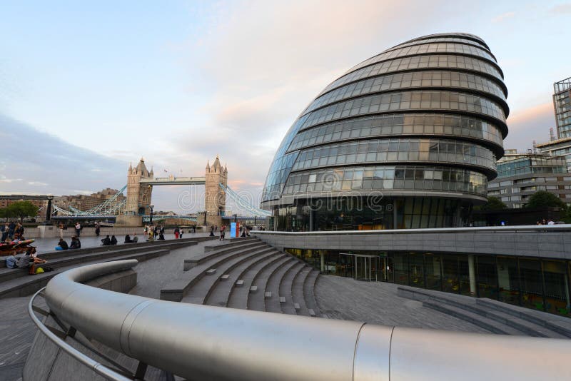 Modern curved lines of the city hall building in London on the Thames river banks. Modern curved lines of the city hall building in London on the Thames river banks