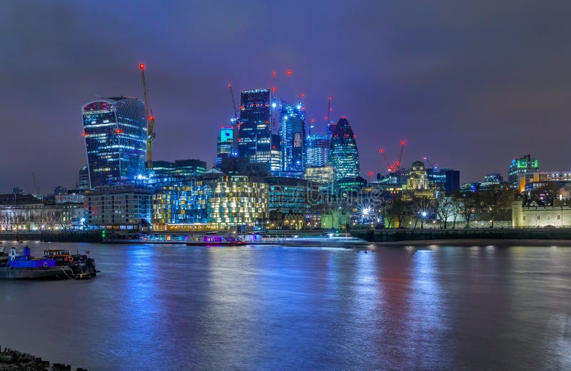 London City Skyline at Night with Skyscrapers Against Cloudy Ski Stock ...