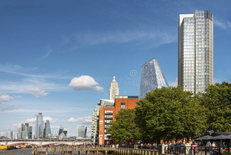 London City Skyline,and Tugs Pulling Container Barges Along the River ...