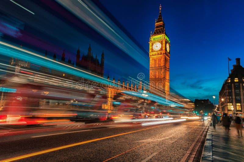 London Big Ben and Westminster Bridge with Palace of Westminster. Blurry people because of Long Exposure. London Big Ben and Westminster Bridge with Palace of Westminster. Blurry people because of Long Exposure