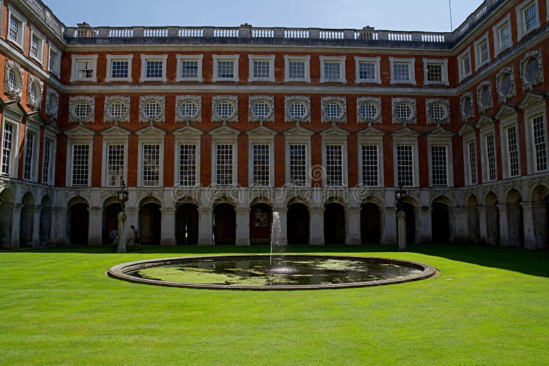 London, England, July 16th 2019: View of Hampton Court Palace courtyard with blue sky royalty free stock photo London, England, July 16th 2019: View of Hampton Court Palace courtyard with blue sky royalty free stock photo
