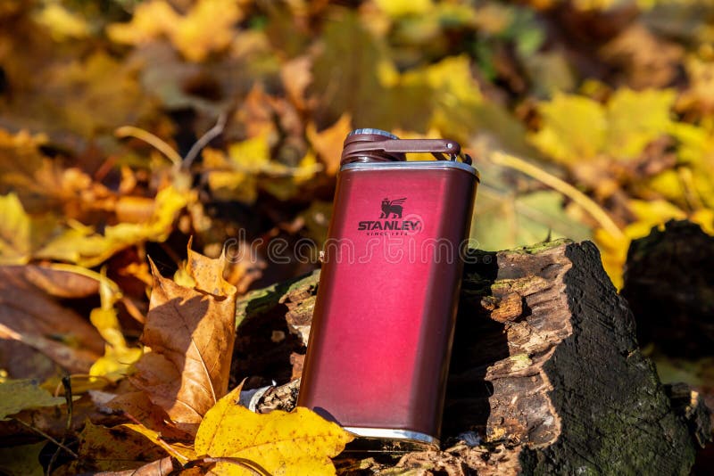 London. England. November 22, 2020. Stanley alcohol flask in the autumn forest